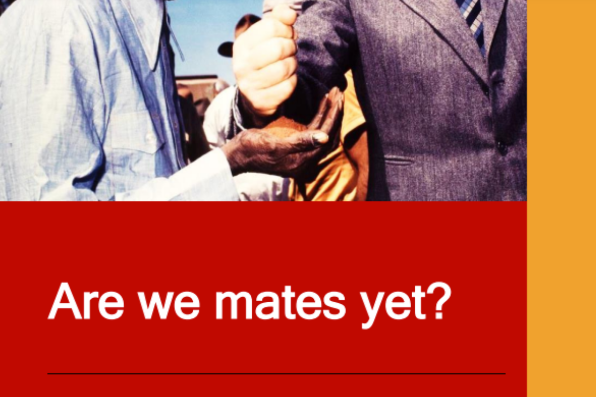 Image showing a handshake between two individuals, one in traditional attire and one in a suit, with the text 'Are we mates yet?' on a red background, framed by an orange border.